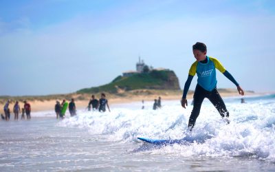 5 Tips to Getting Up on a Surfboard at Nobbys Beach Newcastle